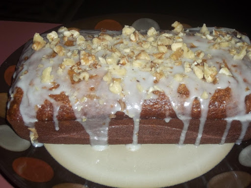 Banana, zucchini bread w/drizzle of frosting and nuts..