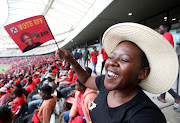 An EFF supporter smiles during the party's manifesto launch at Moses Mabhida Stadium in Durban on Saturday February 10 ahead of the general elections this year. 