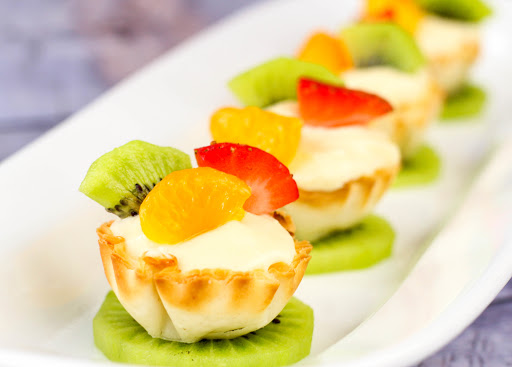 Fruit placed on top of the Phyllo Fruit Tarts.