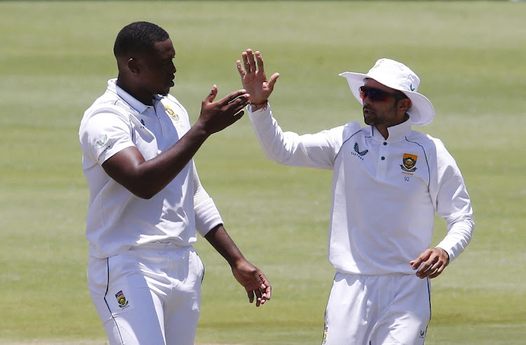 Proteas fast bowler Lungi Ngidi celebrate the wicket of India's Ravichandran Ashwin with spinner Keshav Maharaj at the Wanderers on Wednesday.