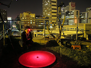 Claudia Tocco from the Wits School of Animal, Plant and Environmental Sciences performs the dung beetle experiment on the university roof in Braamfontein, Johannesburg. 