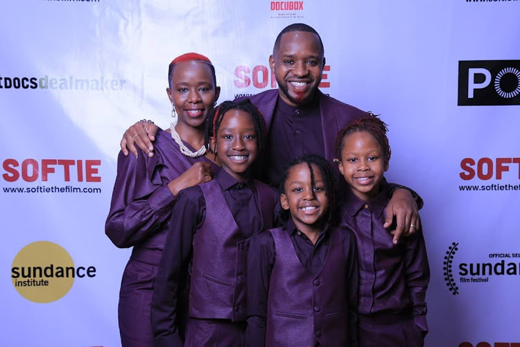 Boniface Mwangi, his wife and their children