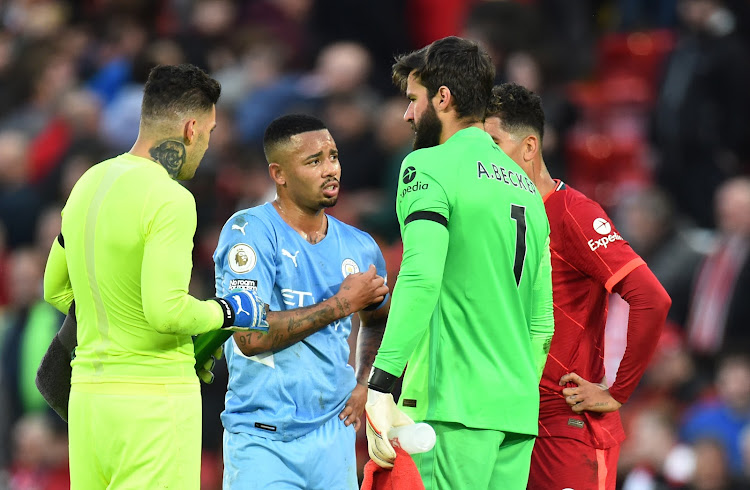 Gabriel Jesus talks to City's Ederson and Liverpool's Alisson and Roberto Firmino