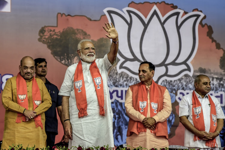 Narendra Modi waves to the supporters in Ahmedabad, India, May 26 2019. Picture: ATUL LOKA/GETTY IMAGES