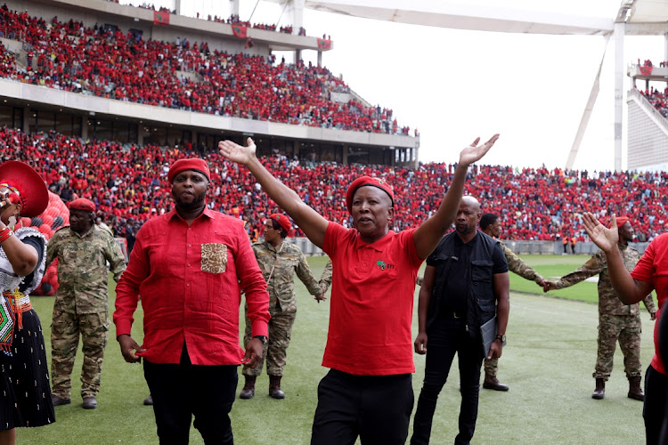 EFF leader Julius Malema greets supporters at the party's election manifesto launch at Moses Mabhida Stadium in Durban on Saturday.