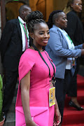 Acting public protector Kholeka Gcaleka wearing an elegant dress, arrives at Cape Town City Hall ahead of state of the nation address .