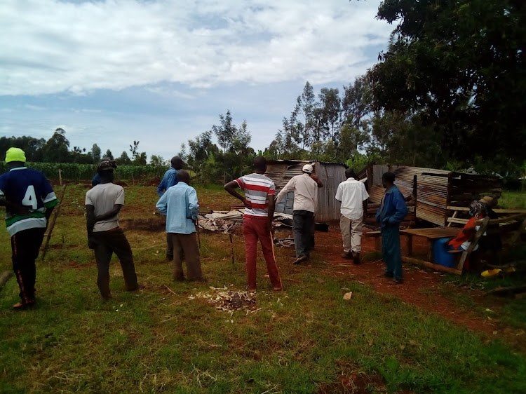 Some residents of Konyunyo village near the scene where the body of Boniface Orwa was charred in Kasibondo Kasipul constituency.