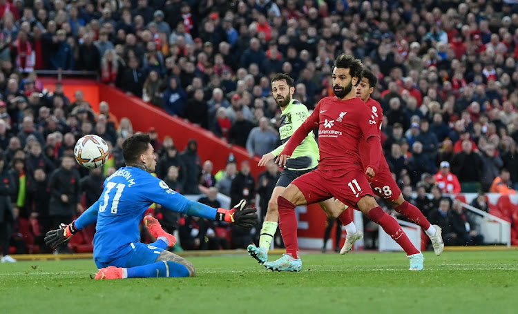 Super Salah: Liverpool’s Mohamed Salah slides the ball past Man City goalkeeper Ederson to score the winner at Anfield in Liverpool, England, October 16 2022. Picture: LAURENCE GRIFFITHS/GETTY IMAGES