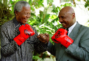 A file photo of former president Nelson Mandela squaring up to Marvin Hagler at Genadendal, the president's official Cape Town residence. 