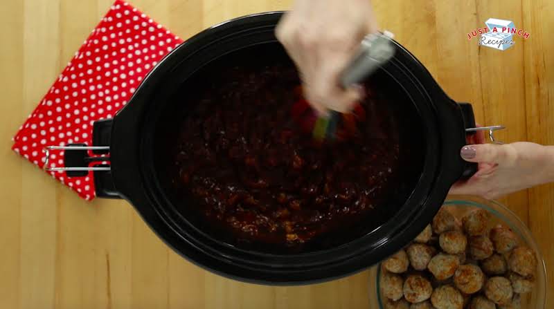 Hand Mixing Crushed Pineapple, Cranberry Sauce, Brown Sugar And Homemade Chili Sauce