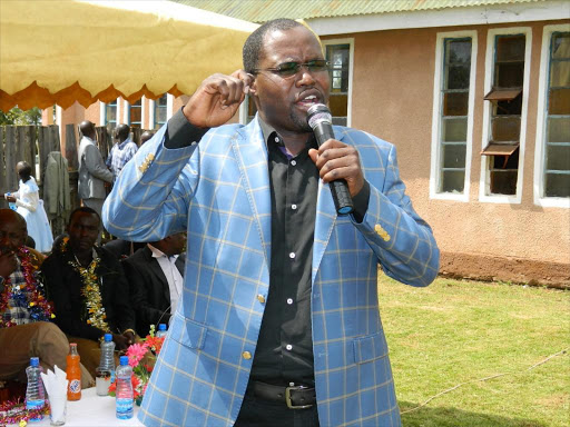 Emurua Dikirr MP Johana Ng'eno speaking at Holy Cross catholic church in Aldai constituency where they alleged there was a scheme to discredit deputy president William Ruto.PHOTO BY BARRY SALIL