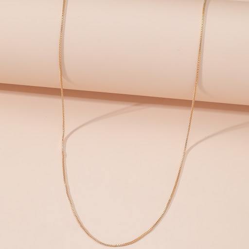 Title 4, Simple Copper Plated Gold Box Necklace. A styli...