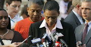 Accompanied by her mother Marion Toller, former track star Marion Jones speaks to the media at Federal Court after pleading guilty in 2005 to lying to a federal agent about her drug use.