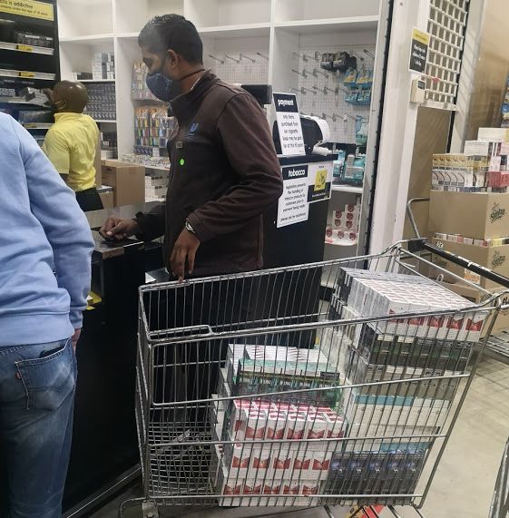 A customer stocks up on cigarettes at Makro in Durban.