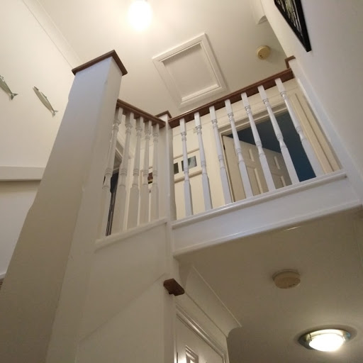 We made remedial repairs to plasterwork, and painted walls with Crown Brilliant White. The woodwork on banister, skirting boards, doors was finished using Pure White Satinwood 