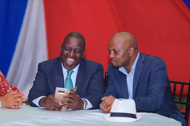 Deputy President William Ruto and Gatundu South MP Moses Kuria at a function on November 29, 2019.