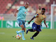 Orlando Pirates' Goodman Mosele is challenged by Ndabayithethwa Ndlondlo of Marumo Gallants in the Nedbank Cup quarterfinal at Peter Mokaba Stadium in Polokwane on March 9 2022. 