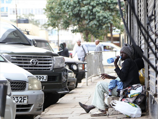 Two women and their children beg along biashara street April 10,2017.In the recent past,there has been an influx of street families within the central business district.Photo/HEZRON NJOROGE