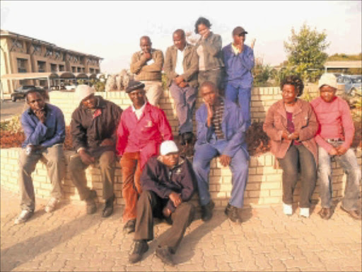 DESPAIR: Some of the workers who claim they were fired by the NW department of public works.