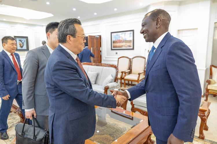 President William Ruto greets China Export-Import Bank Chairman Wu Fulin at the Kenyatta International Convention Centre, Nairobi on May 9, 2024.