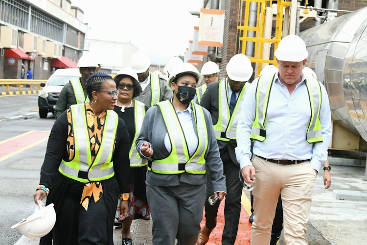 KwaZulu-Natal premier Nomusa Dube-Ncube (centre) with SAB CEO Richard Rivett-Carnac (right) during a visit to the Prospecton plant, south of Durban.