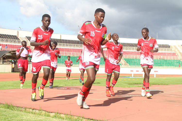 Rising Starlets players warm up ahead their World Cup qualifiers match against Cameroon on Friday