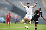 Mohamed Hammia of JS Saoura and Paseka Mako of Orlando Pirates during the CAF Confederation Cup match between Orlando Pirates and JS Saoura.