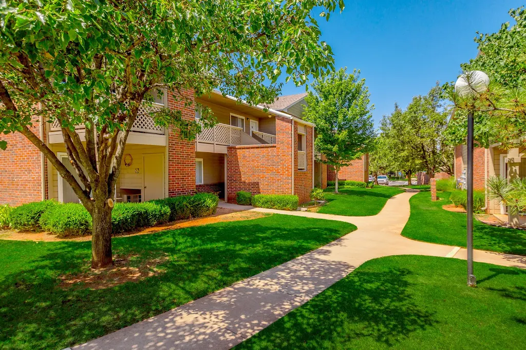 Paths between community buildings including light poles, shade trees