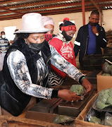 Workers from Gugulethu Farm with MEC Bongiwe Sithole-Moloi.