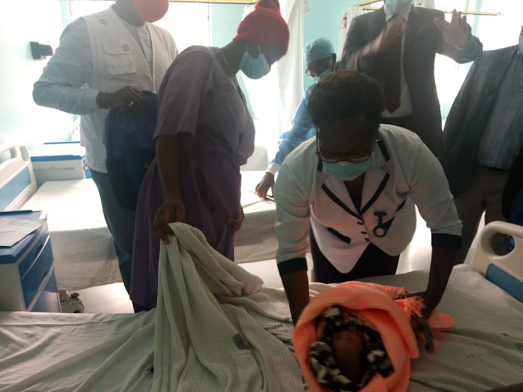 A nurse attends to an infant at Pumwani Maternity Hospital.