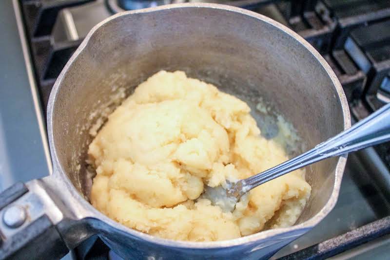 Flour And Salt Stirred Into Boiling Water And Butter Until A Ball Forms.