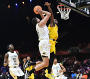 Badr Eddine Azouga of Fus de Rabat in action against Childe Dundao during the 2024 BAL Season 4 match at the SunBet Arena in Pretoria on Thursday, March 14, 2024