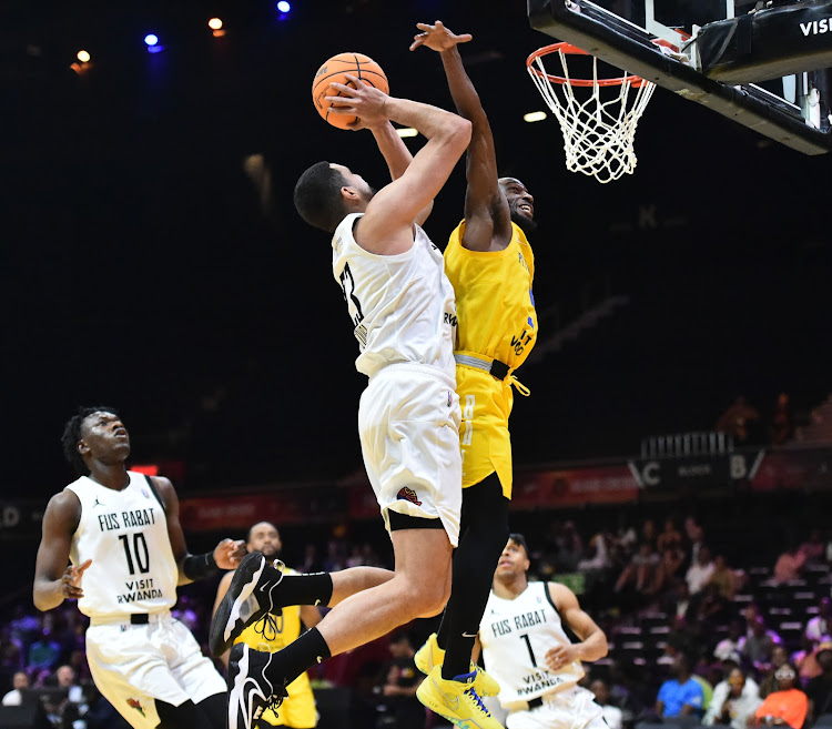 Badr Eddine Azouga of Fus de Rabat in action against Childe Dundao during the 2024 BAL Season 4 match at the SunBet Arena in Pretoria on Thursday, March 14, 2024