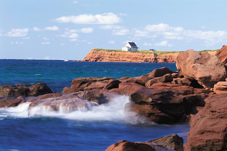 Waves hitting the sandstone rocks at Chepstow on Prince Edward Island, Canada.