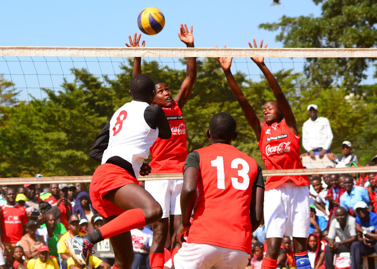 Cheptil's Sheila chepchirchir and Sharon Jeruto block a shot from Kwanthanze's L. Iswan during their KSSSA final match at Kisumu Polytechnic