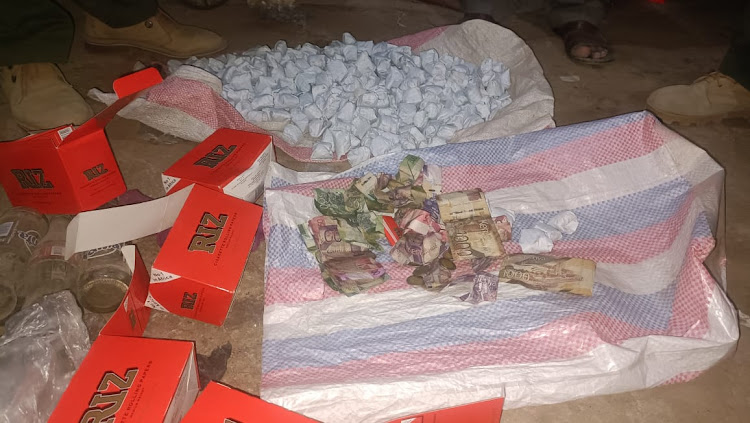 Bhang ,money and rizlers used to roll the bang that were impounded at mororo area.