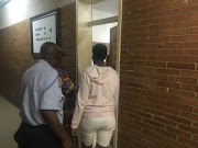 Nomfundo Sambo on the right who accused deputy President David Mabuza of drafting a hit-list being escorted to court in Mbombela on Wednesday. 