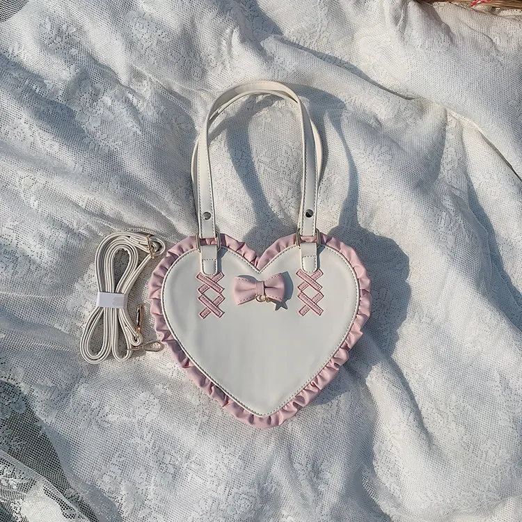 Bolso bandolera para mujer con diseño de corazón cruzado y nudo de amor, elegante y práctico para llevar tus esenciales diarios.
