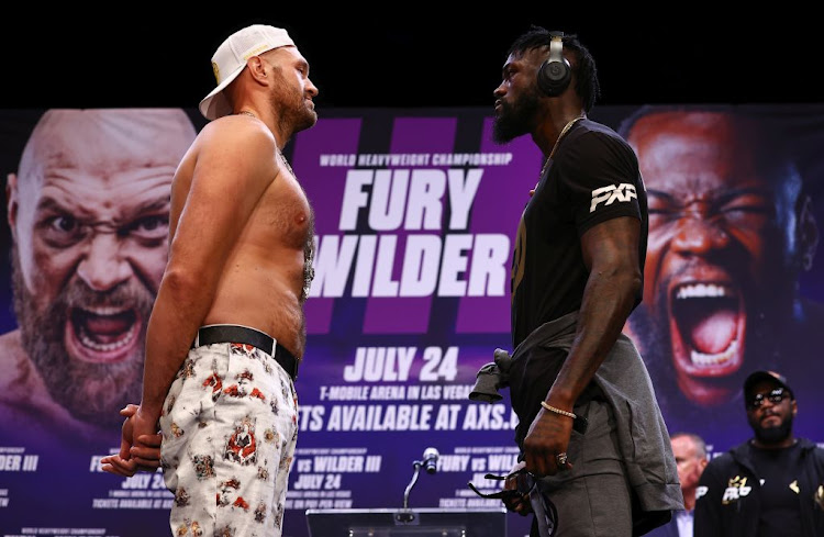 WBC heavyweight champion Tyson Fury, left and Deontay Wilder face-off during their press conference on June 15 2021 in Los Angeles, California