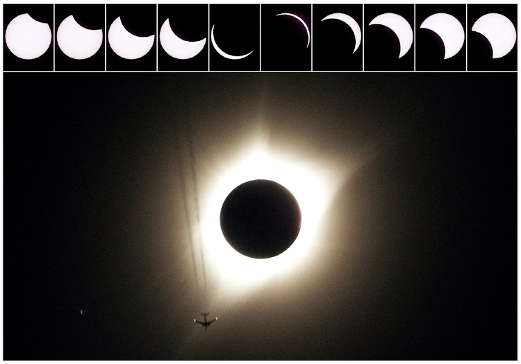 A combination of ten pictures shows the progression of a partial solar eclipse near as a jet plane flies by the total solar eclipse in Guernsey, Wyoming US, August 21, 2017.
