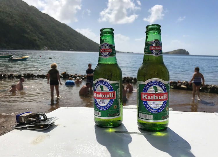 Kubuli lager beer, "Dominica's pride," at a volcano-heated hot spot on Dominica. 