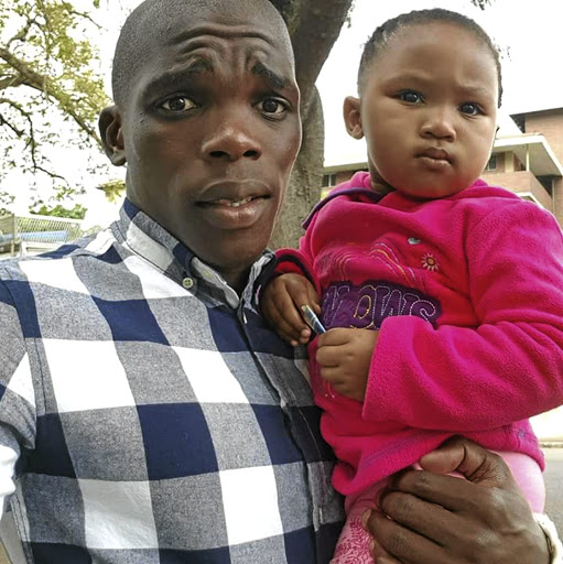 Lamontville Golden Arrows right-back Siyabonga Dube and his daughter, Lisakhanya. / Supplied