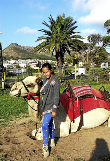 Matilde dos Santos and Izak the camel.