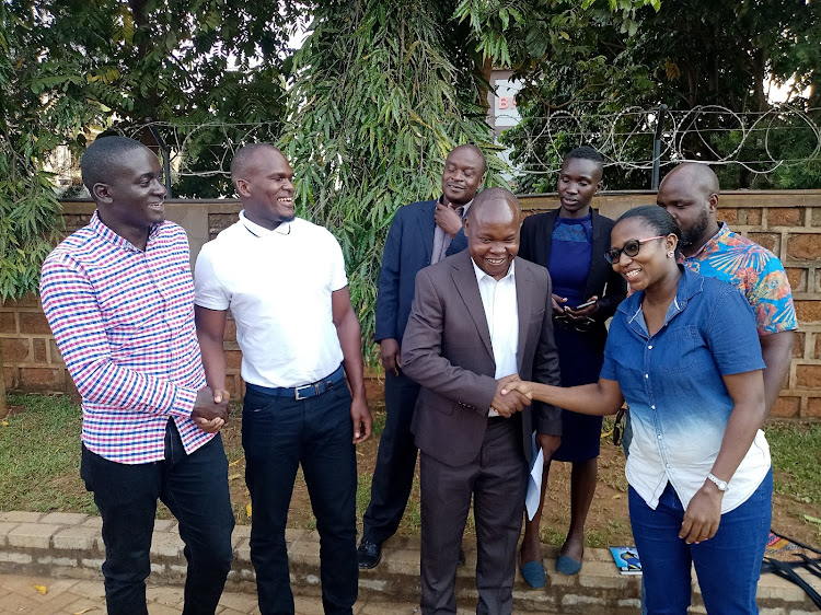 LSK West Kenya branch members led by the chair George Murunga (holding white paper) enjoy a light moment after addressing a press conference in Busia on January 20, 2023.