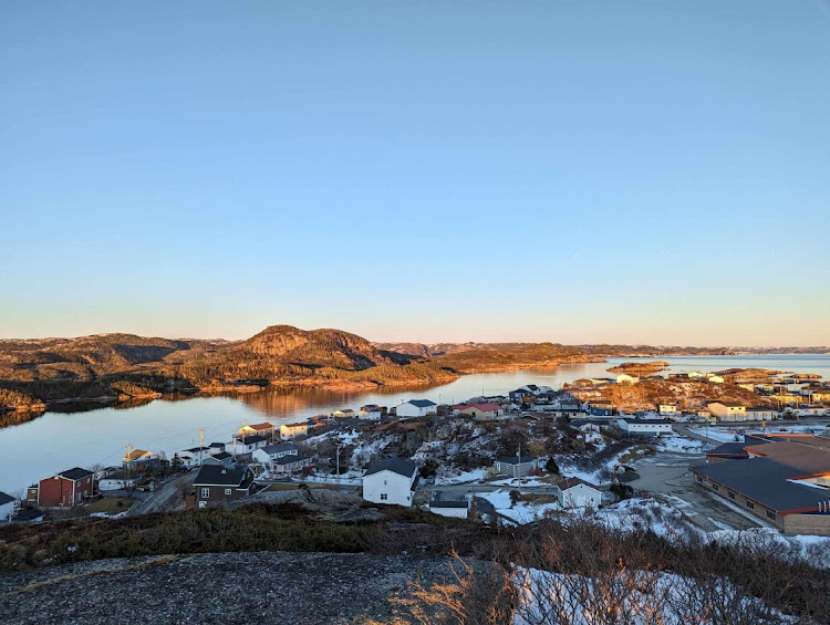 A view from the top of Maiden Tea Hill overlooks the seaside town of Burgeo, with the small Eclipse Island, named by Royal Navy explorer Captain James Cook in 1766, at top right in Newfoundland, Canada.