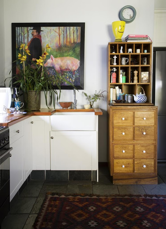 Art and a rug are easy ways to add character to a rented kitchen.