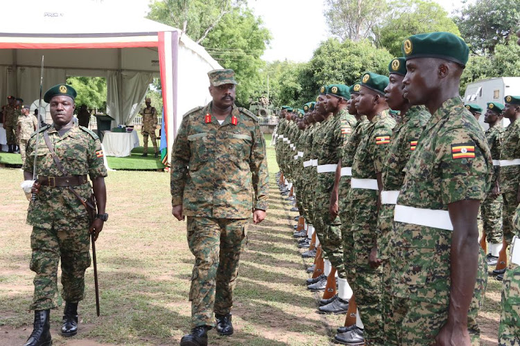 Gen Muhoozi inspects a guard of honor at the UPDF 4th division HQs.