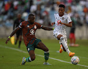 George Maluleka of AmaZulu FC challenges Relebohile Ratomo of Orlando Pirates during the DStv Premiership 2022/23 match on May 20 2023 at Moses Mabhida Stadium.