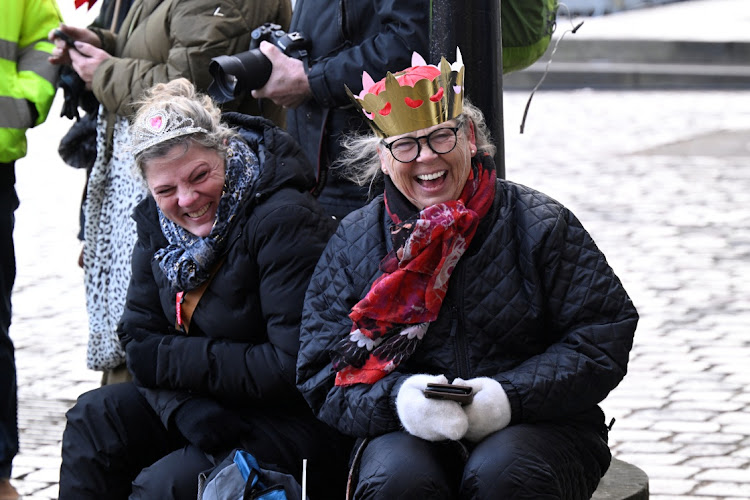 Susanne and Anette from Broendby react as they wait at Christiansborg Palace Square, as Queen Margrethe abdicates in Copenhagen, Denmark, on Sunday. Picture: RITZAU SCANPIX DENMARK/NILS MEILVANG VIA REUTERS