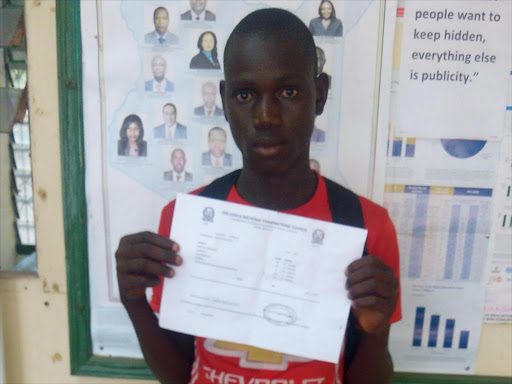 Juma Chiro displays his certificate during an interview on Thursday, January 4, 2018. /CHARI SUCHE